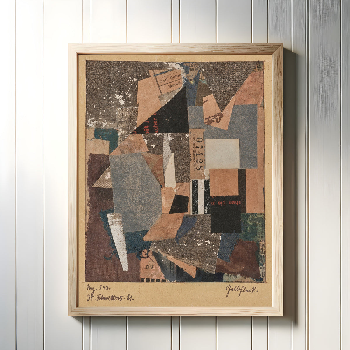 Framed art print of Mz. 247. Gelbfleck by Kurt Schwitters, in a light wood frame on a white panelled wall