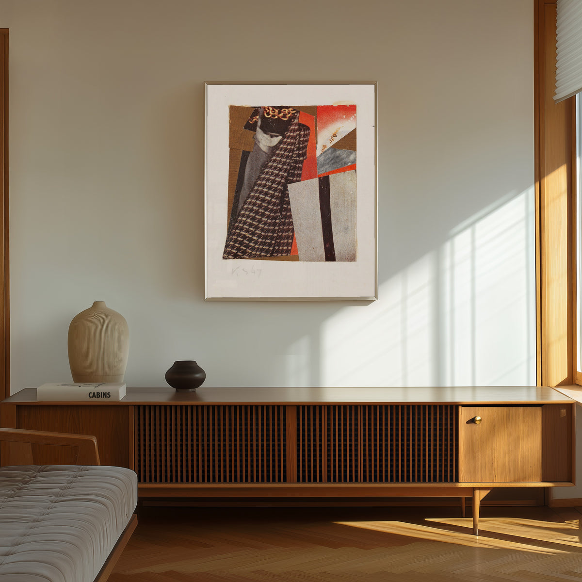 Framed art print of Ohne Titel (but but), Merzzeichnung by Kurt Schwitters, in a thin light frame on a sunlit wall above a wooden sideboard