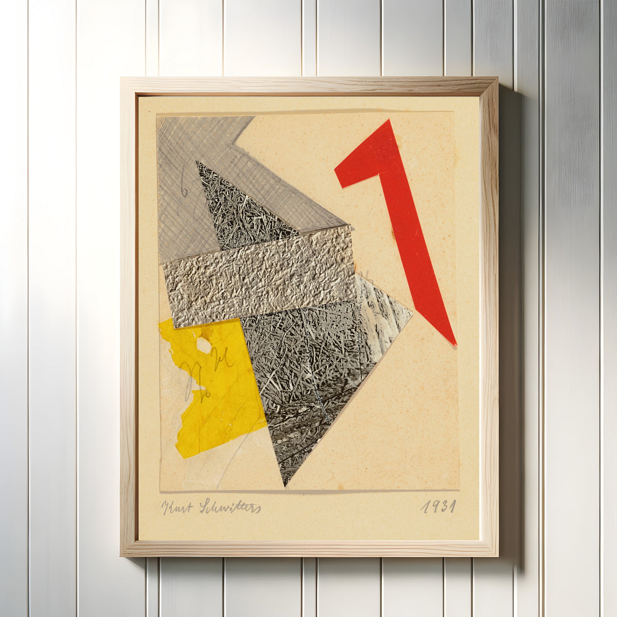 Framed art print of Ohne Titel by Kurt Schwitters, in a light wood frame on a white panelled wall