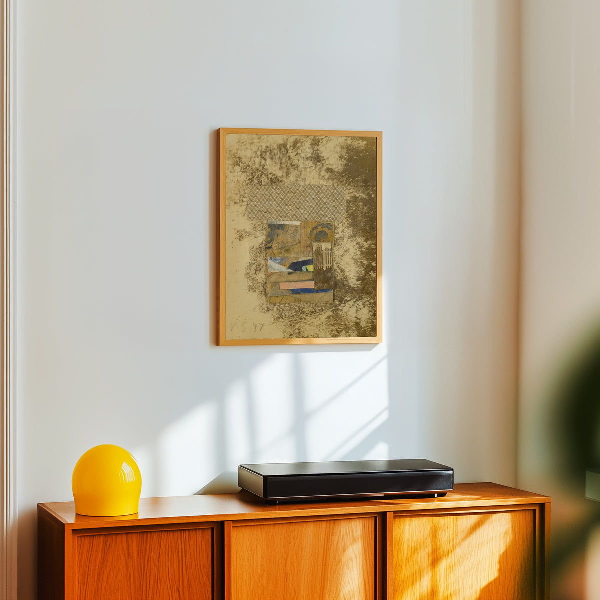 Framed art print of Ohne Titel (Merzzeichnung In Merzzeichnung) (Untitled… by Kurt Schwitters, in a light wood frame on a white wall above an orange sideboard