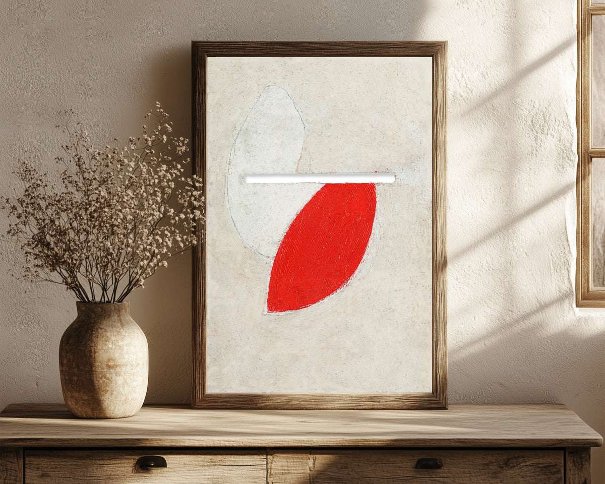 Framed art print of Ohne Titel (Mit Schlitz) by Kurt Schwitters, in a dark wood frame leaning on a rustic console beside dried flowers