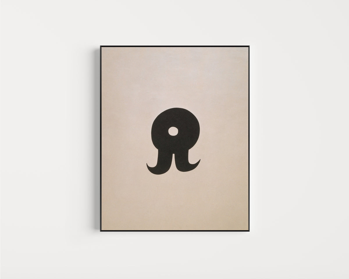 Framed art print of Schnurruhr by Kurt Schwitters, in a slim black frame on a plain white wall