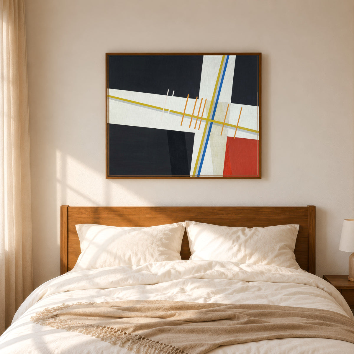 Framed art print of Am 3 by László Moholy-Nagy, in a slim wood frame above a bed in a sunlit bedroom