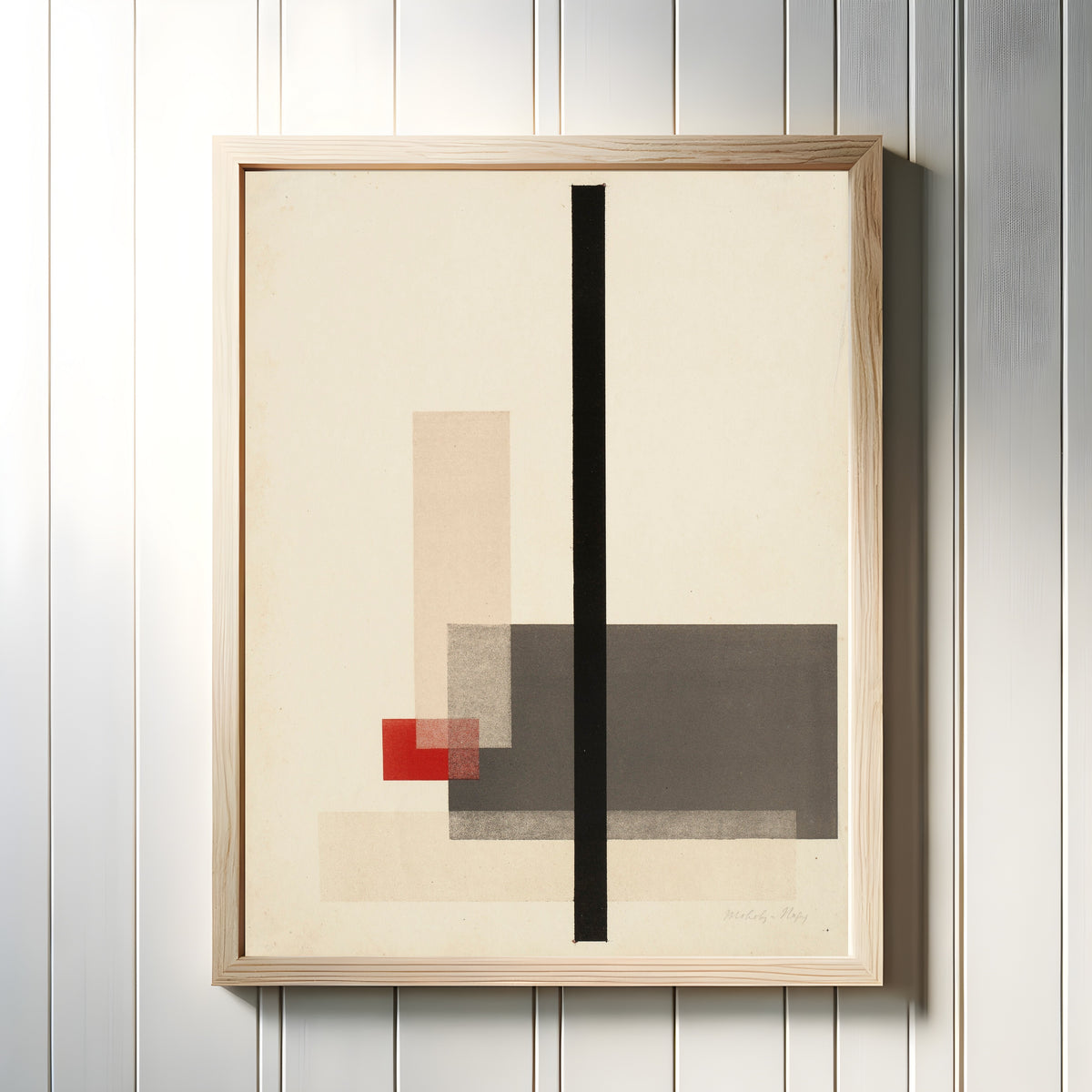 Framed art print of Composition (1923) by László Moholy-Nagy, in a light wood frame on a white panelled wall