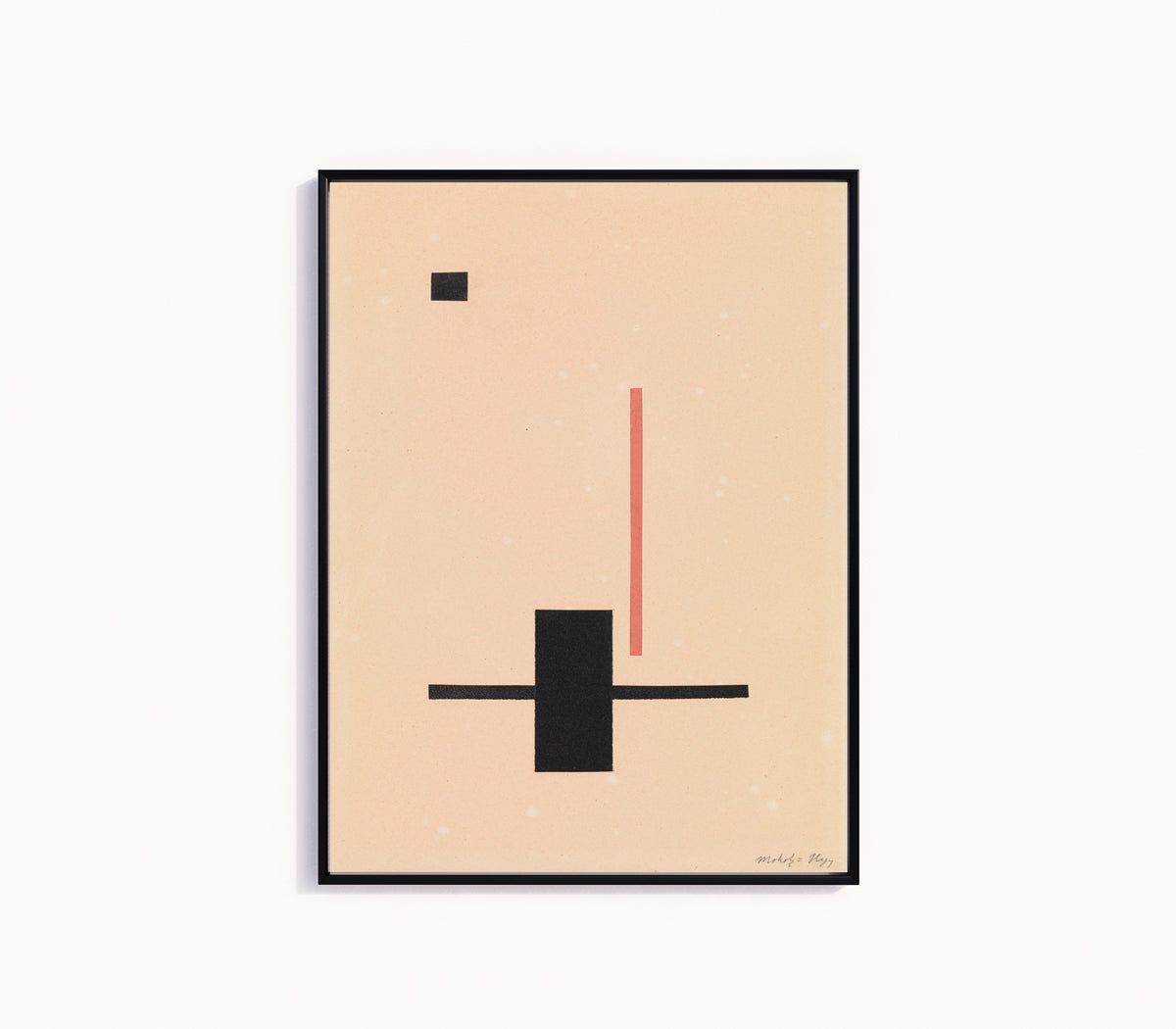 Framed art print of Composition by László Moholy-Nagy, in a slim black frame on a plain white wall