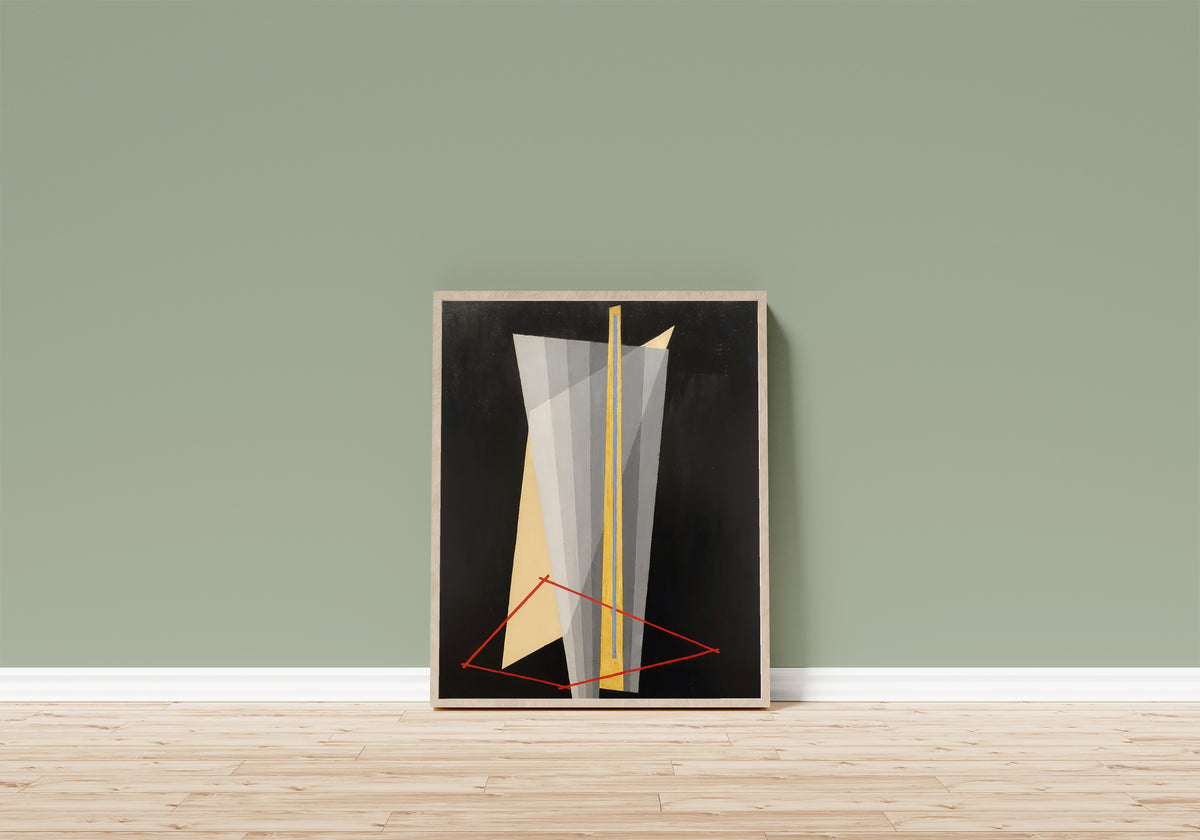 Framed art print of Construction (1922) by László Moholy-Nagy, in a light wood frame leaning on a sage green wall above a wooden floor