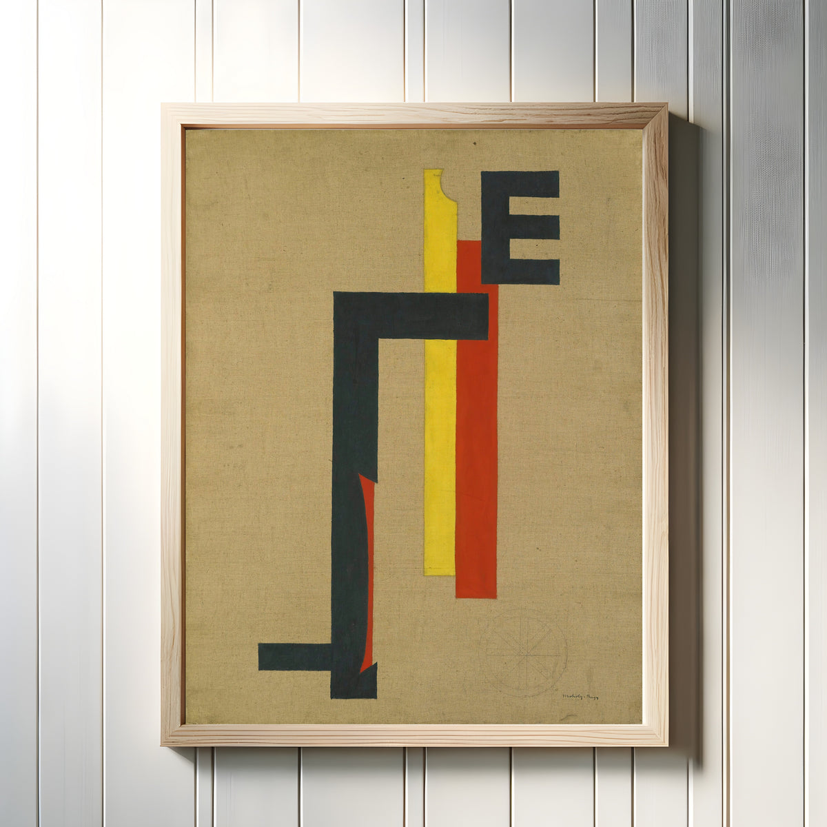 Framed art print of E-Bild (E Picture) by László Moholy-Nagy, in a light wood frame on a white panelled wall