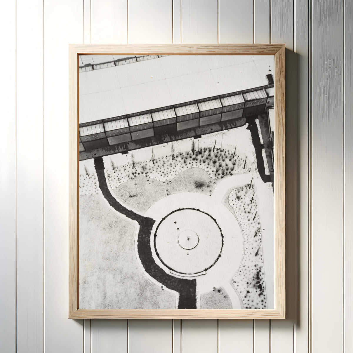 Framed art print of From the Radio Tower, Berlin by László Moholy-Nagy, in a light wood frame on a white panelled wall