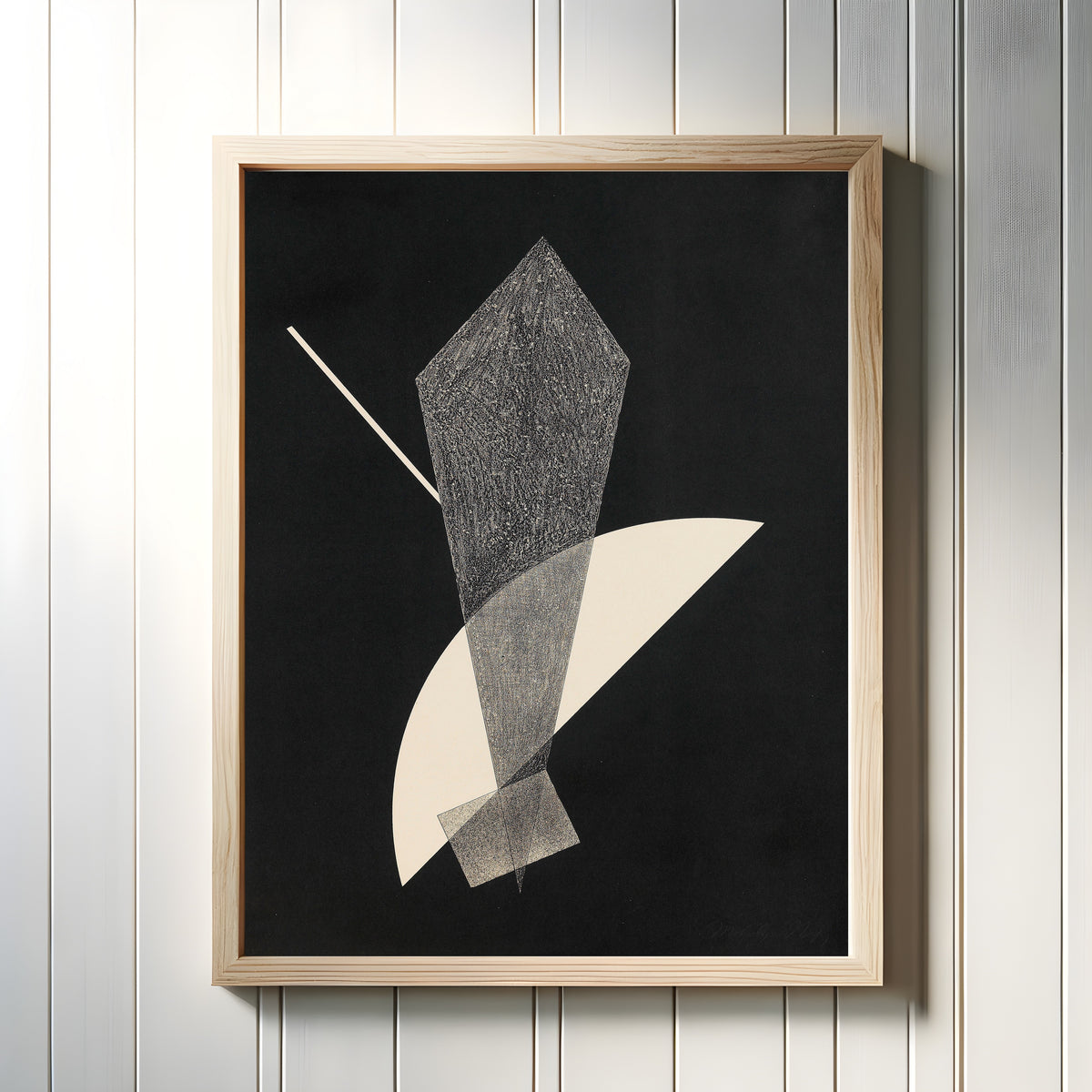 Framed art print of Konstruktion V (1923) by László Moholy-Nagy, in a light wood frame on a white panelled wall
