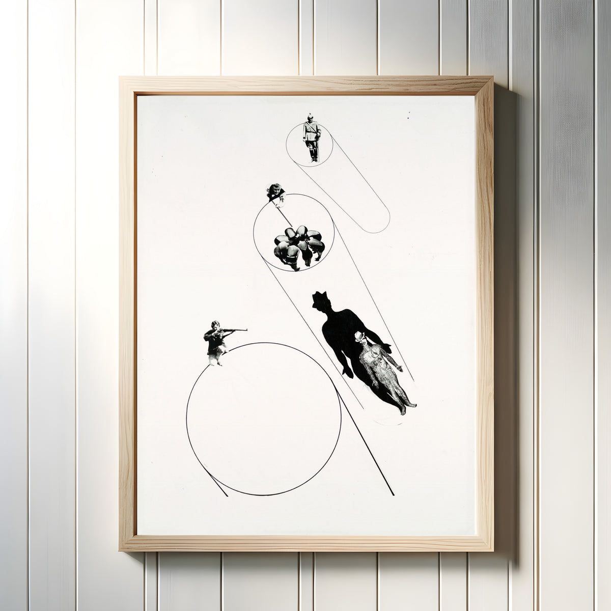 Framed art print of Target Practice (In the Name of the Law) by László Moholy-Nagy, in a light wood frame on a white panelled wall