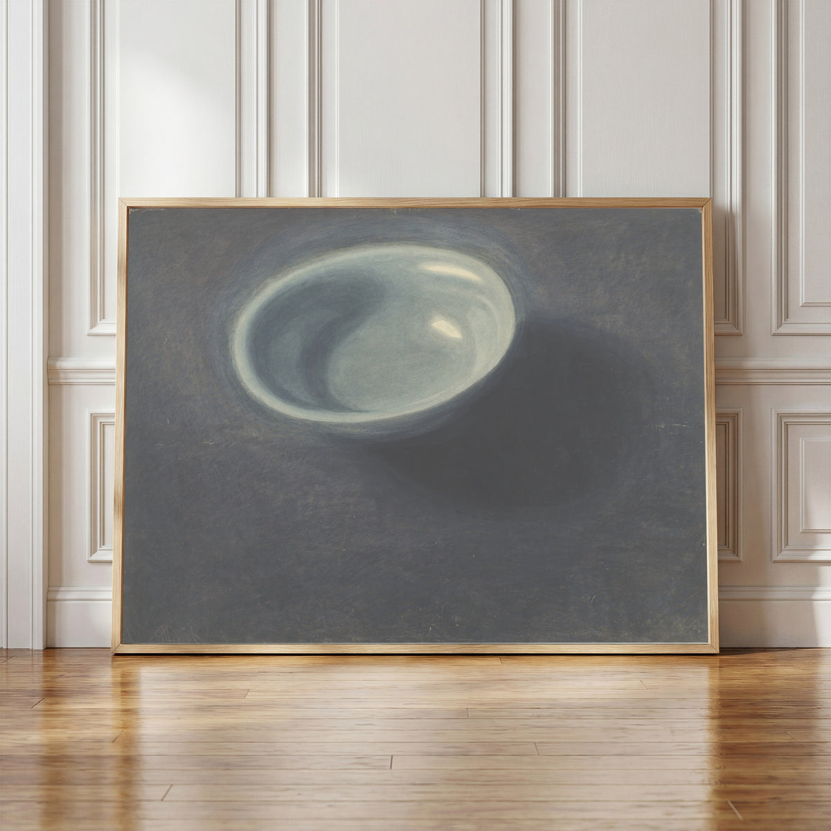Framed art print of De blauwe teil by Léon Spilliaert, in a light wood frame leaning against a panelled white wall