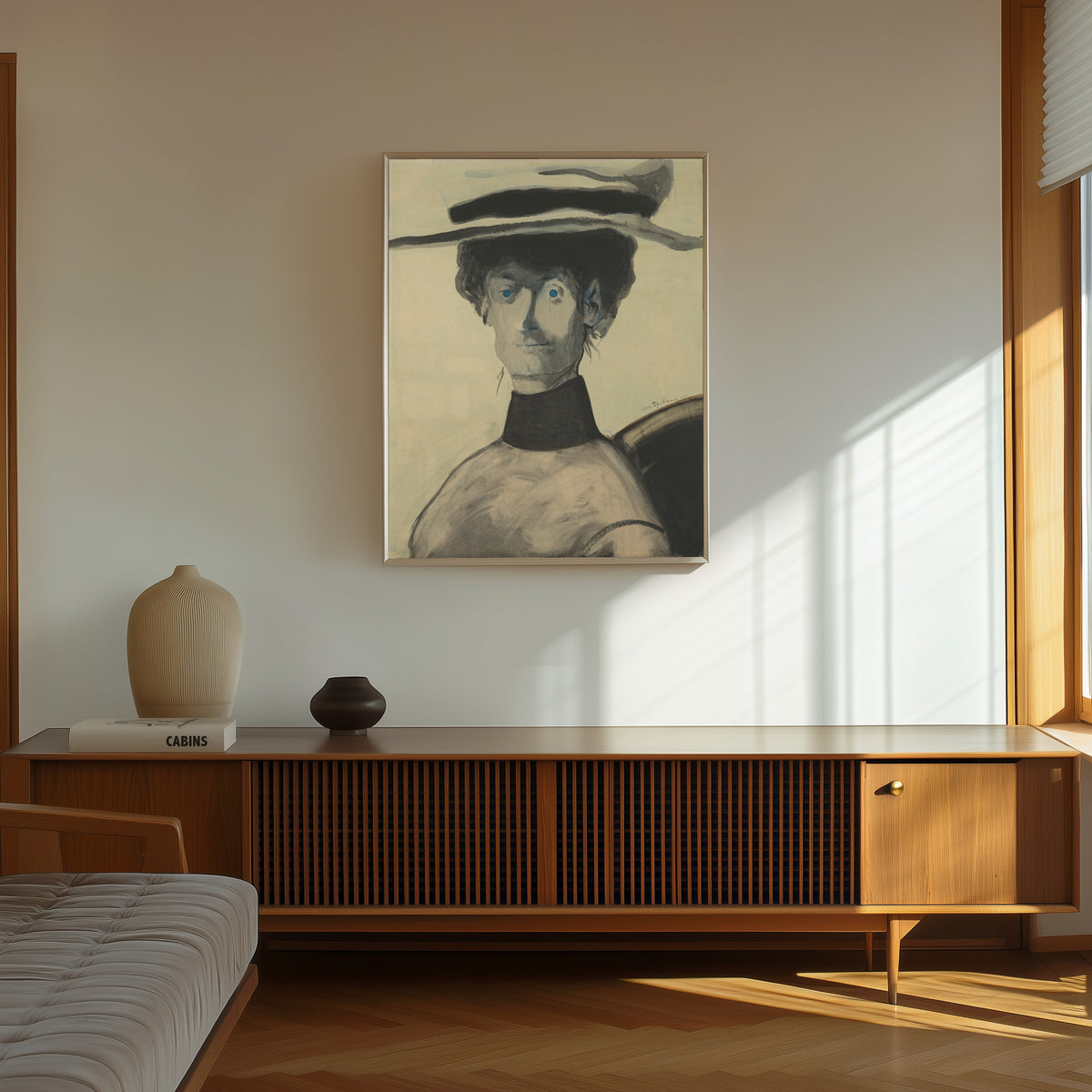 Framed art print of Vrouw met roze hoed by Léon Spilliaert, in a thin light frame on a sunlit wall above a wooden sideboard