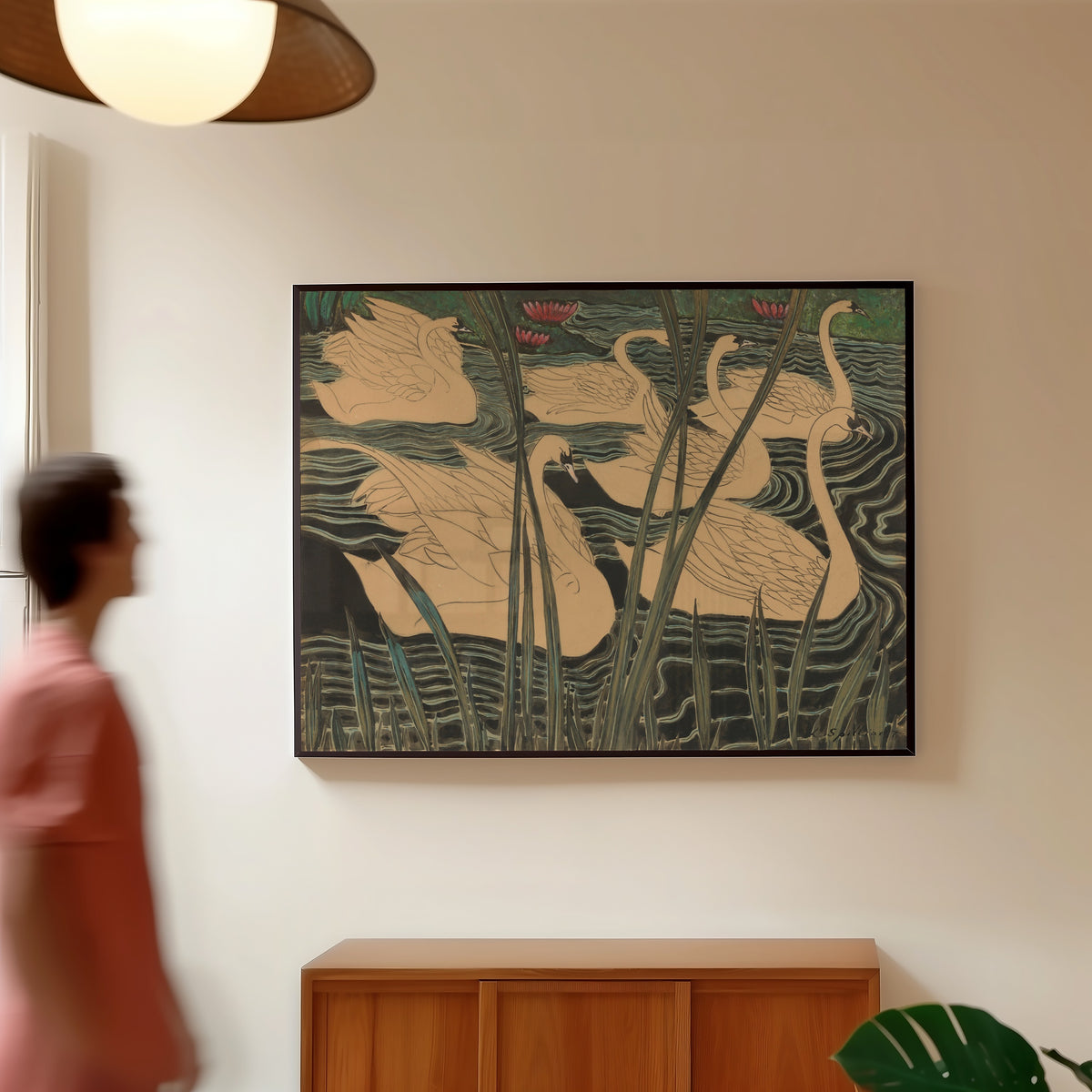 Framed art print of Zwanen by Léon Spilliaert, in a slim black frame on a warm wall in a sunlit room