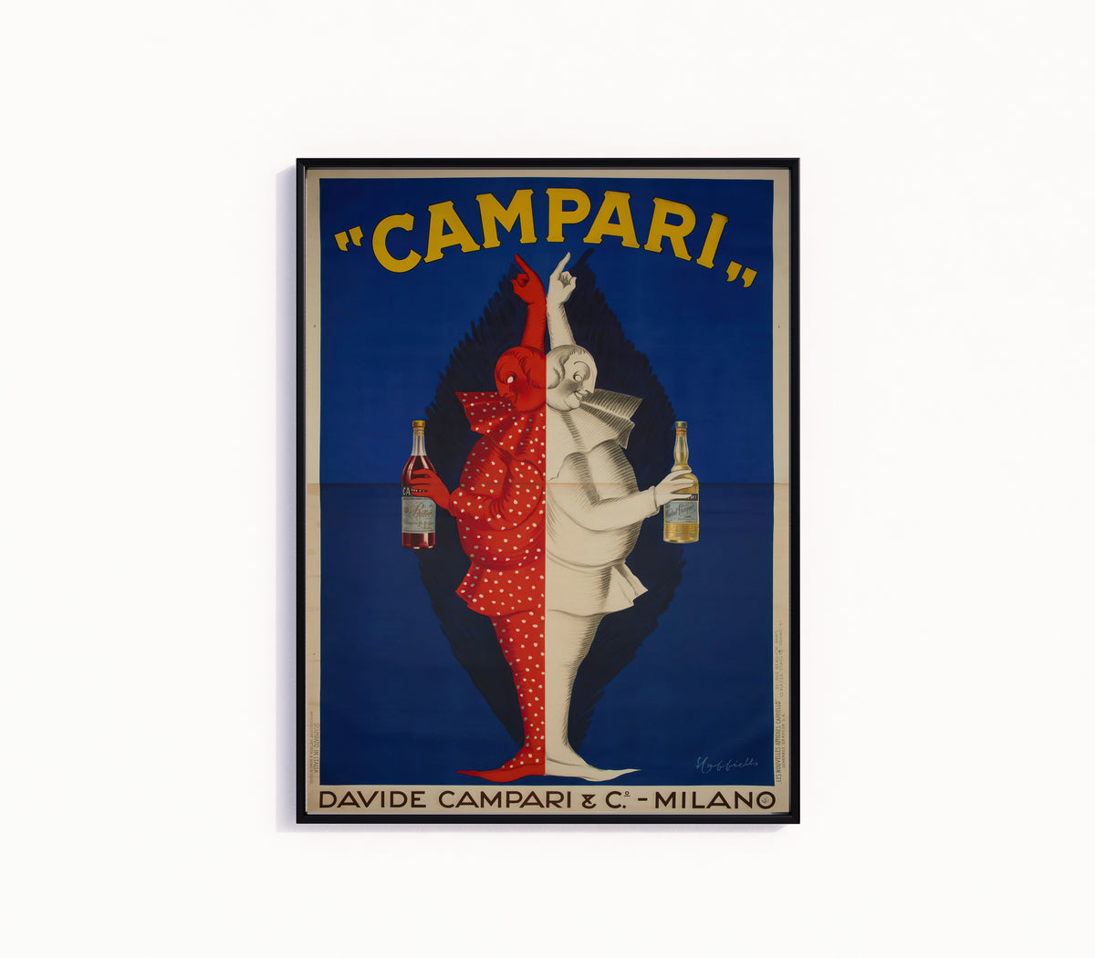 Framed art print of Campari by Leonetto Cappiello, in a slim black frame on a plain white wall
