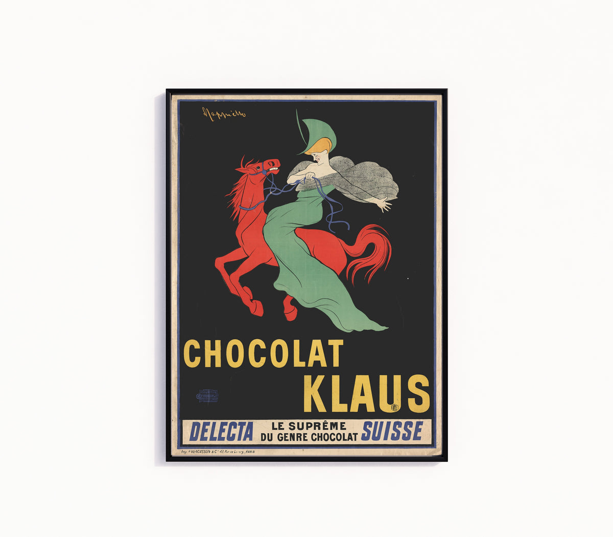 Framed art print of Chocolat Klaus by Leonetto Cappiello, in a slim black frame on a plain white wall
