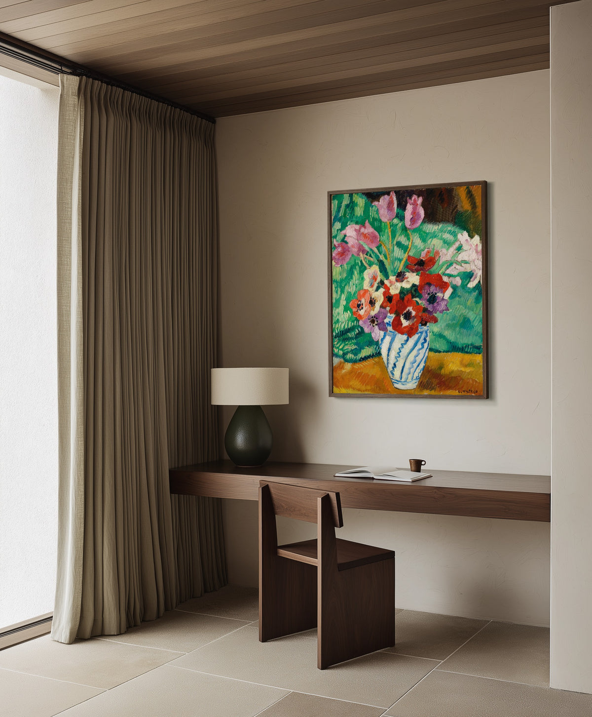 Framed art print of Tulips and Anemones by Louis Valtat, in a dark wood frame on a plaster wall above a walnut desk