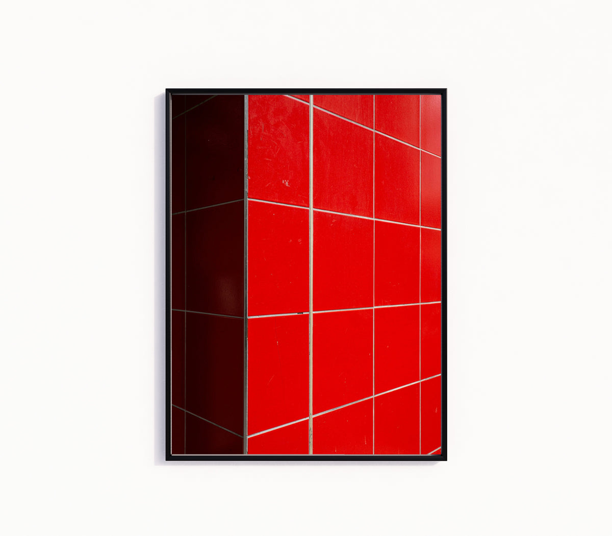 Framed art print of Light and Shadow IV by Marcus Lenk, in a slim black frame on a plain white wall