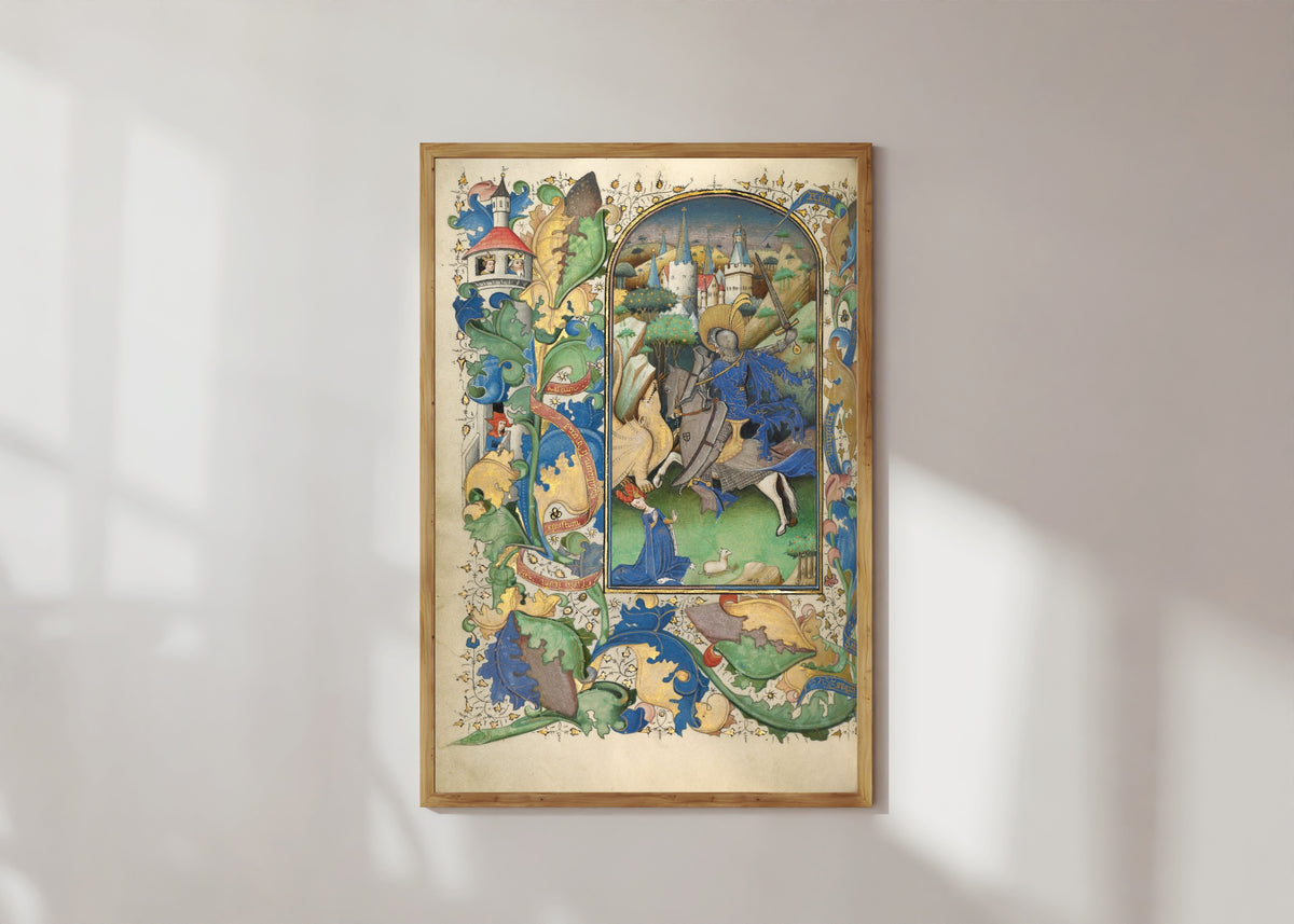 Framed art print of Saint George and the Dragon by Master of Guillebert de Mets, in a light wood frame on a sunlit white wall