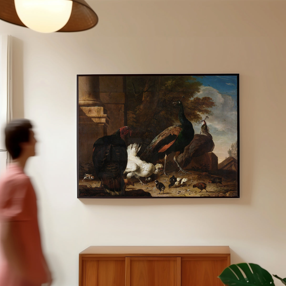 Framed art print of Een hen met pauwen en een kalkoen (A Hen with Peacocks… by Melchior d'Hondecoeter, in a slim black frame on a warm wall in a sunlit room