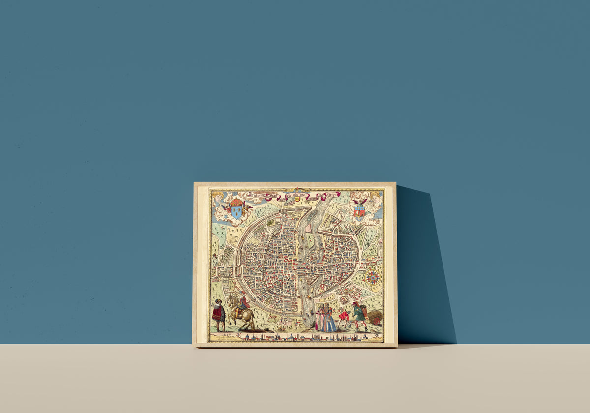 Framed art print of Map of Paris: The True Portrait of the City by Melchior Rossignol, in a light wood frame leaning on a blue wall