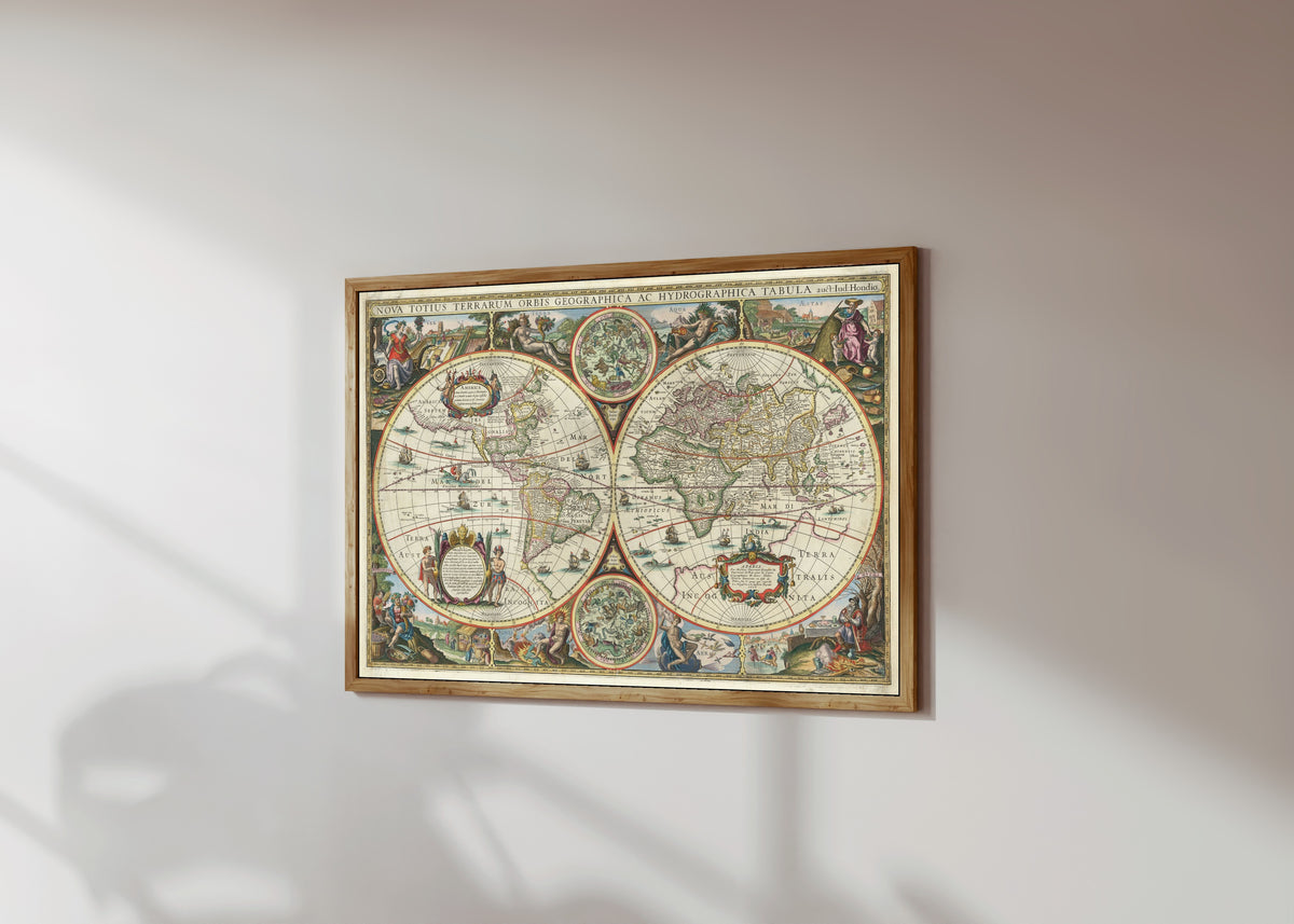 Framed art print of Nova Totius Terrarum Orbis Geographica ac… by Melchior Tavernier II, in a light wood frame on a sunlit white wall, seen at a slight angle