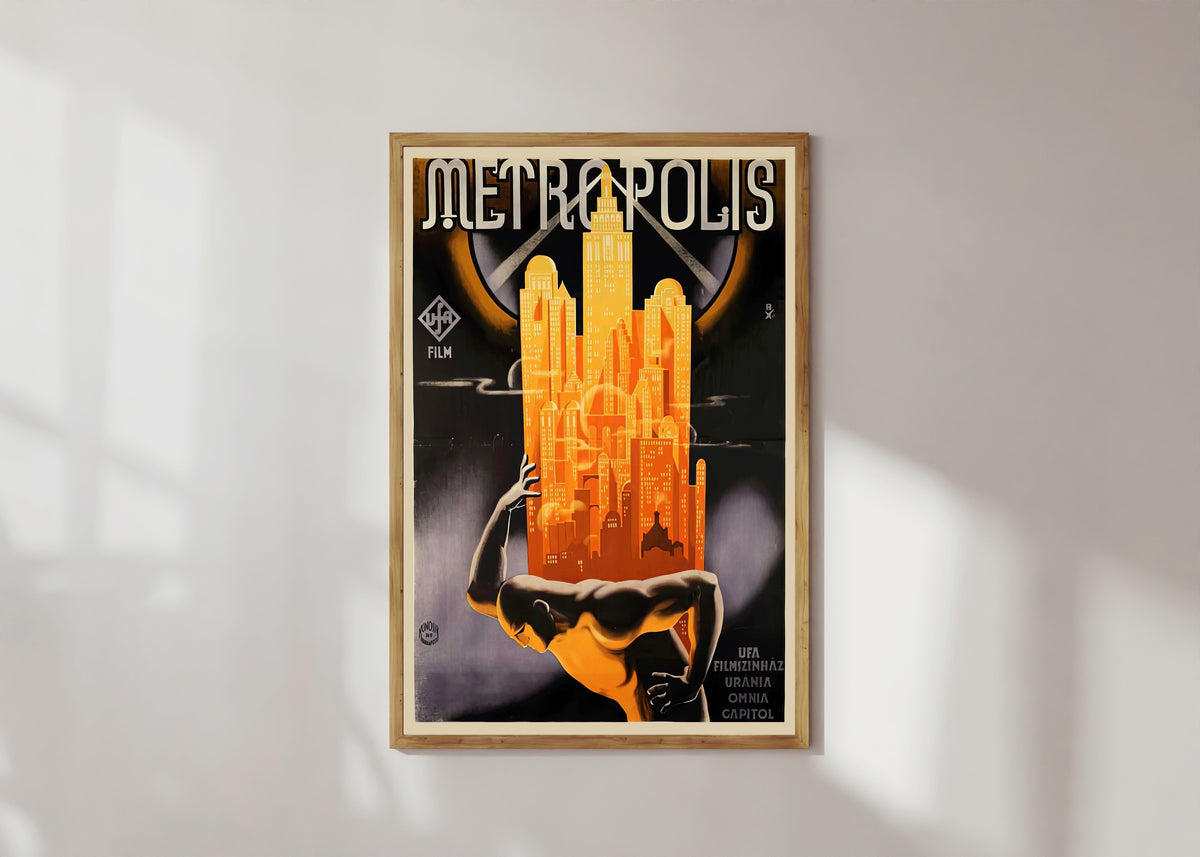 Framed art print of Metropolis Movie Poster by Heinz Schulz-Neudamm, in a light wood frame on a sunlit white wall
