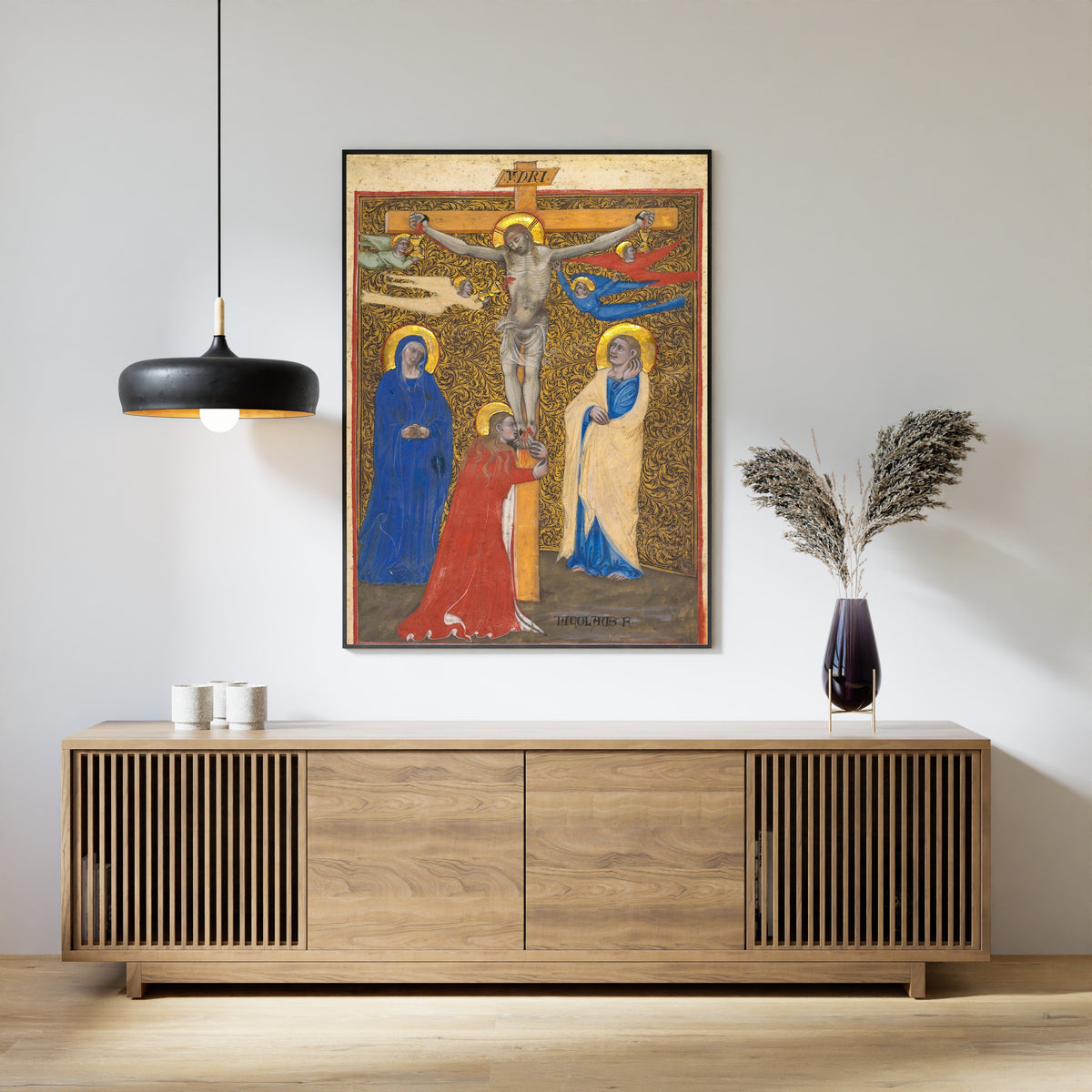 Framed art print of The Crucifixion by Niccolò di Giacomo da Bologna, above a slatted wood sideboard