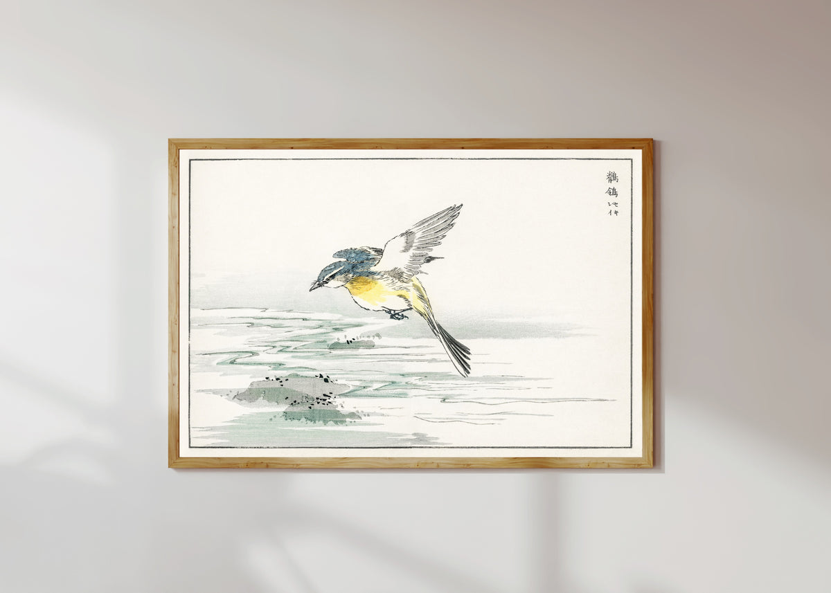 Framed art print of Wagtail over a Stream by Numata Kashū, in a light wood frame on a sunlit white wall