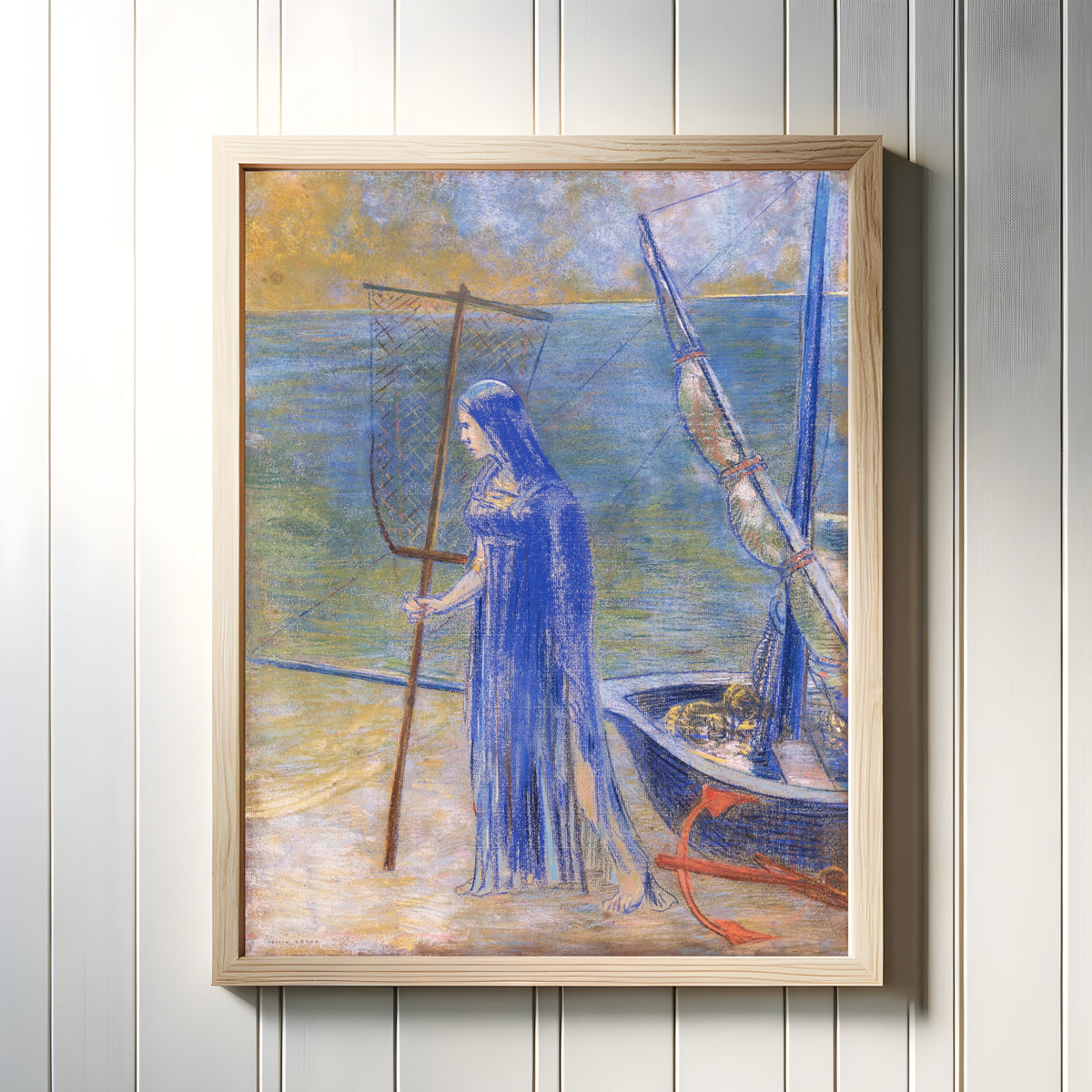 Framed art print of The Fisherwoman by Odilon Redon, in a light wood frame on a white panelled wall