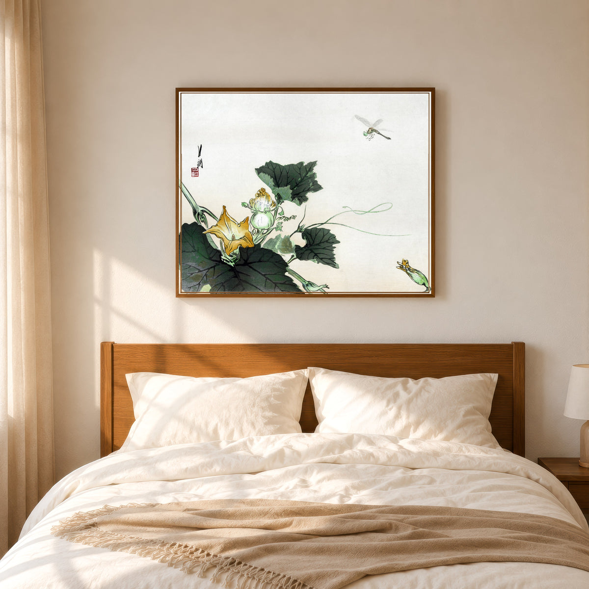 Framed art print of Kabocha ni tonbou (1890–1920) by Ogata Gekkō, in a slim wood frame above a bed in a sunlit bedroom