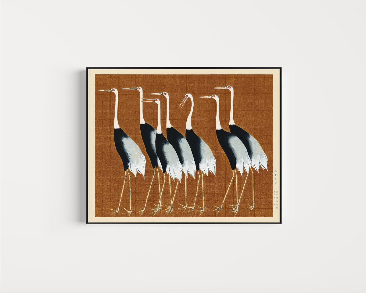 Framed art print of Cranes in Brown by Ogata Korin, in a slim black frame on a plain white wall