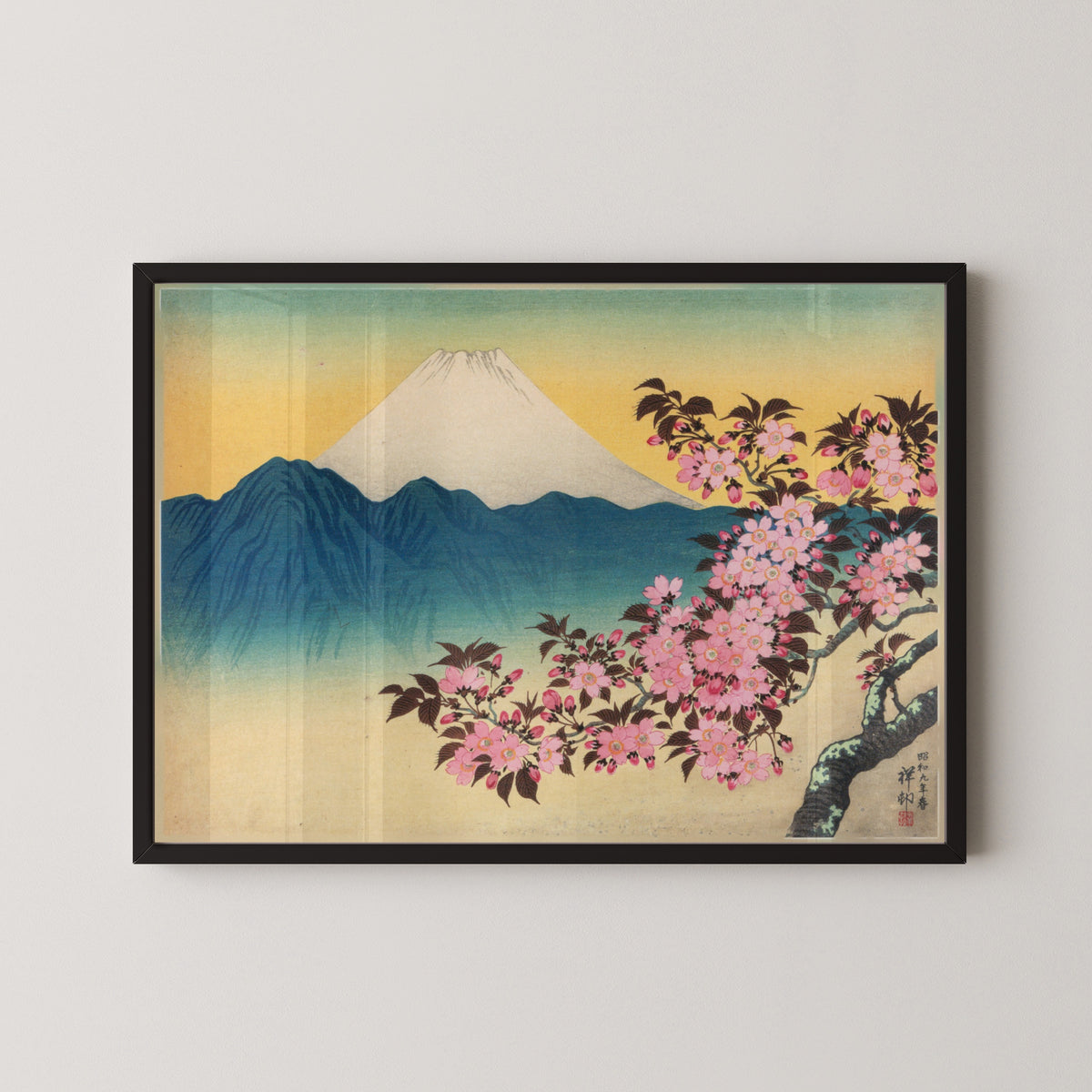 Cherry Blossoms and Mount Fuji by Ohara Koson — in a black frame on a pale wall