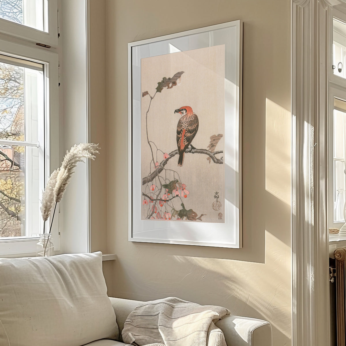 Crossbill and Begonia by Ohara Koson — shown framed on a wall