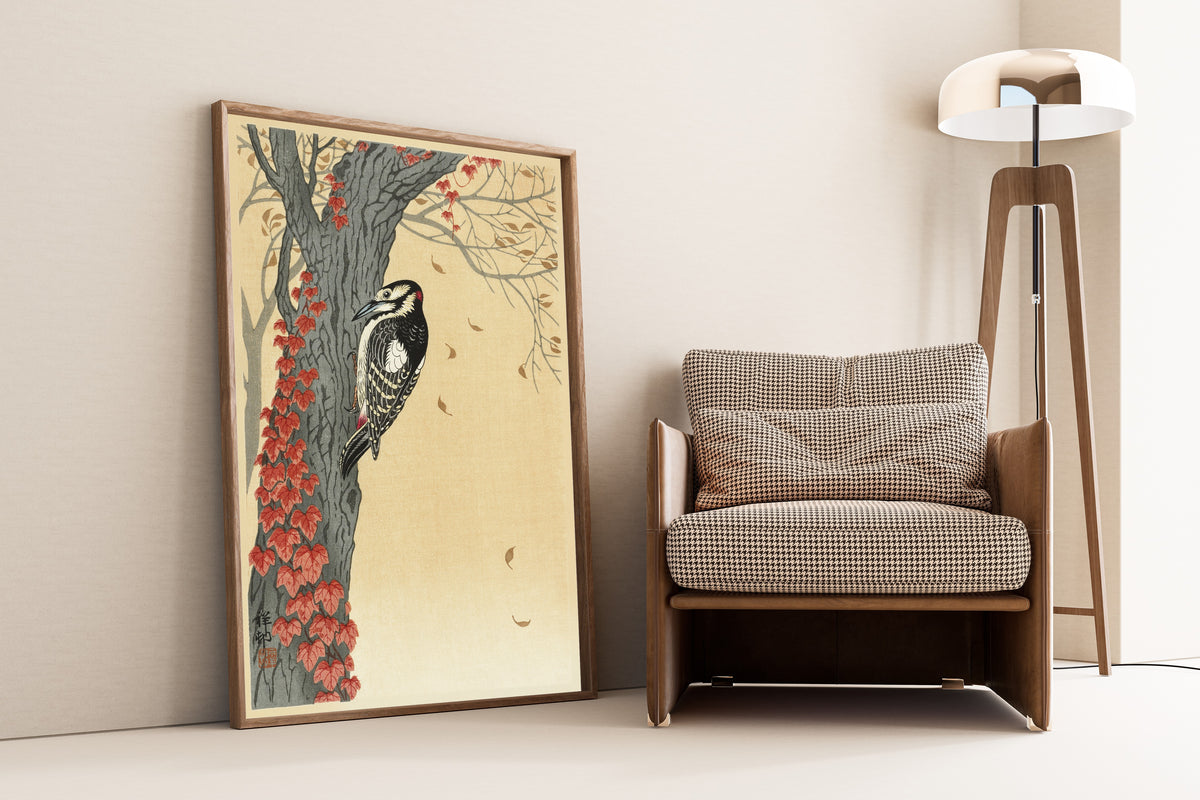 Great Spotted Woodpecker in Tree with Red Ivy by Ohara Koson — framed on the wall of a minimal living room