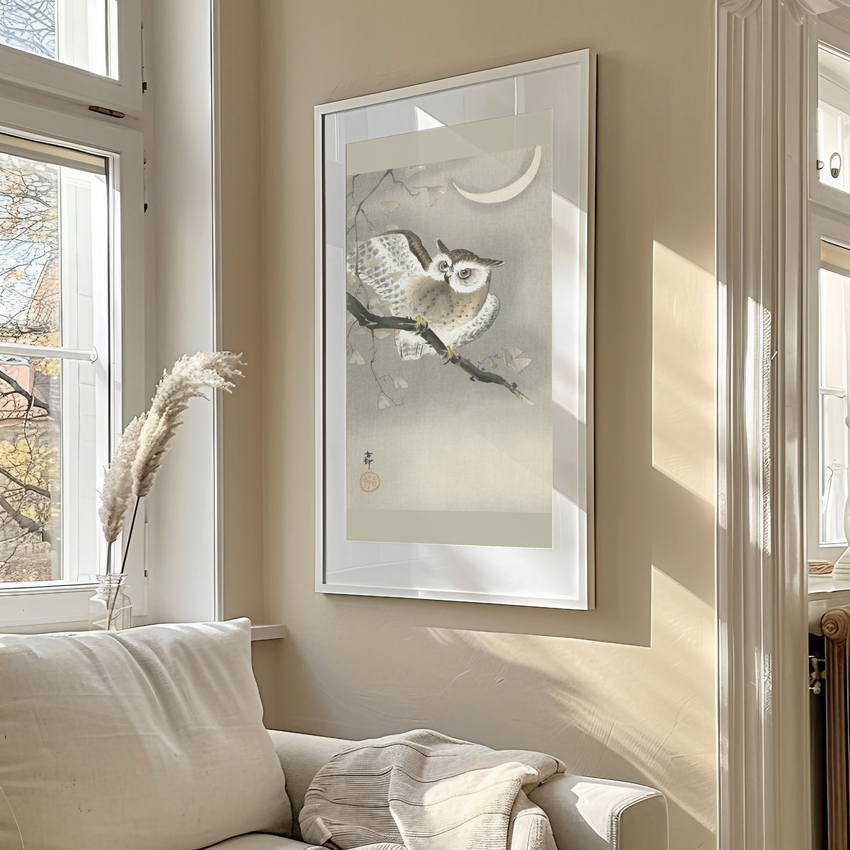 Long-eared Owl in Ginkgo by Ohara Koson — framed in a sunlit living room above a sofa