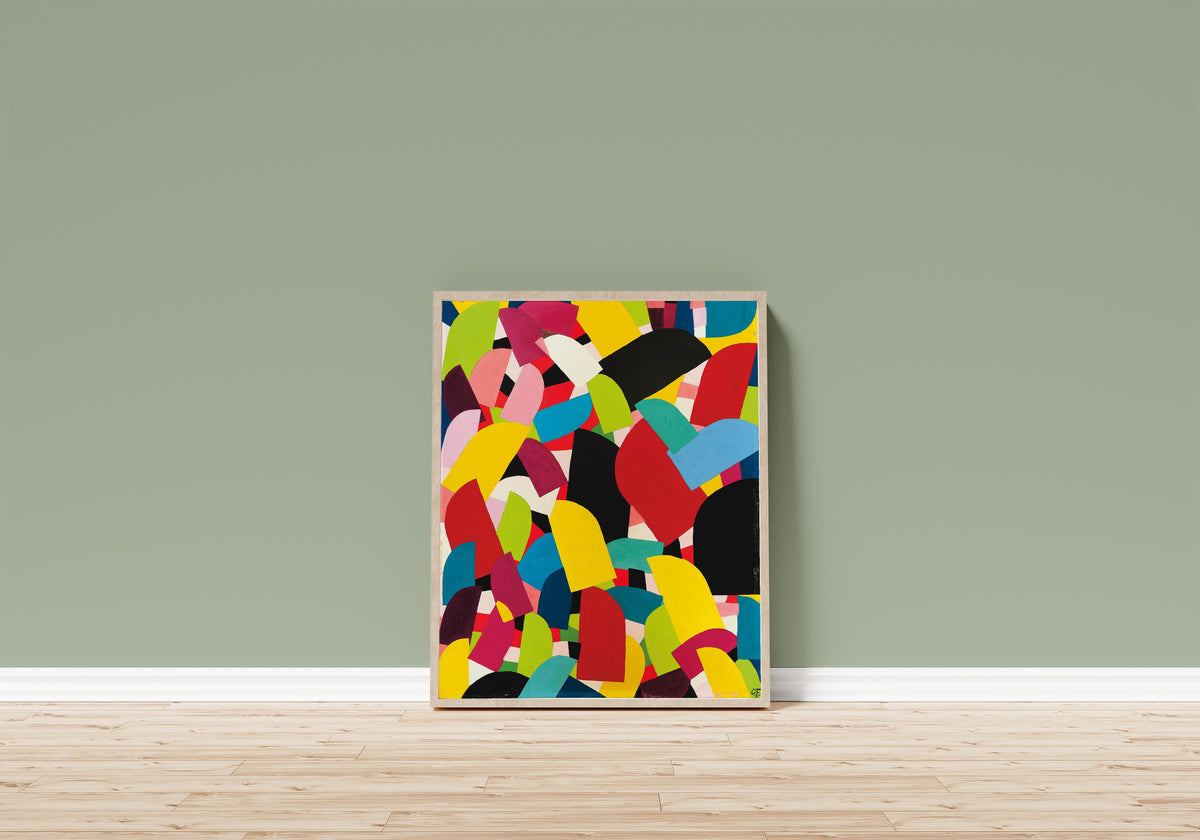 Framed art print of Untitled (1936) by Otto Freundlich, in a light wood frame leaning on a sage green wall above a wooden floor