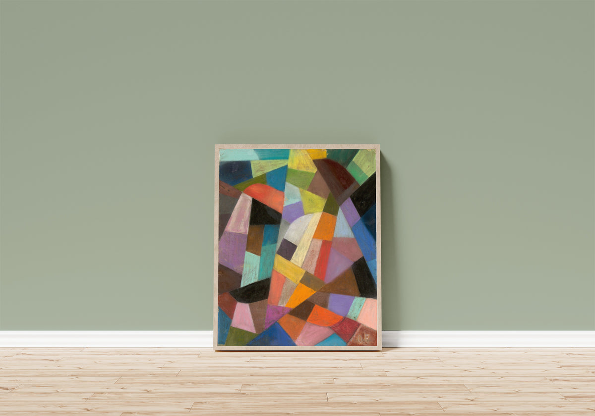 Framed art print of Untitled (1938) by Otto Freundlich, in a light wood frame leaning on a sage green wall above a wooden floor