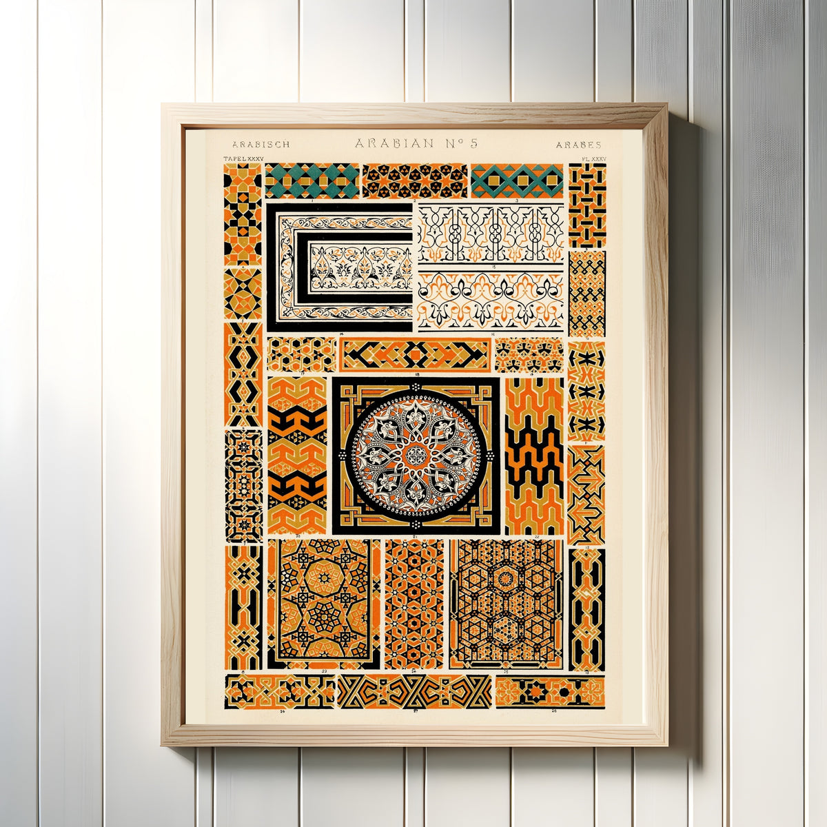 Framed art print of Arabesque by Owen Jones, in a light wood frame on a white panelled wall