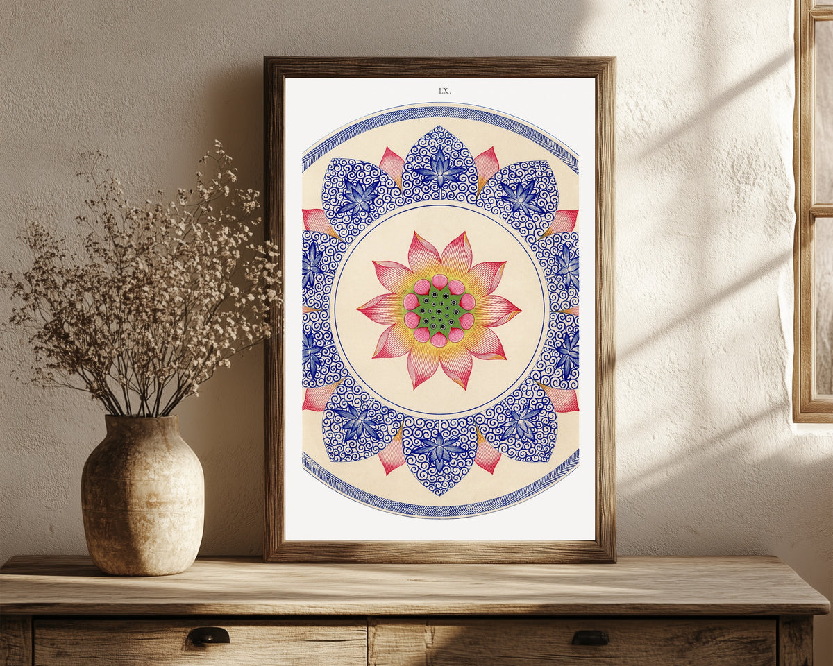 Framed art print of Examples of Chinese Ornament, Plate 60 by Owen Jones, in a dark wood frame leaning on a rustic console beside dried flowers