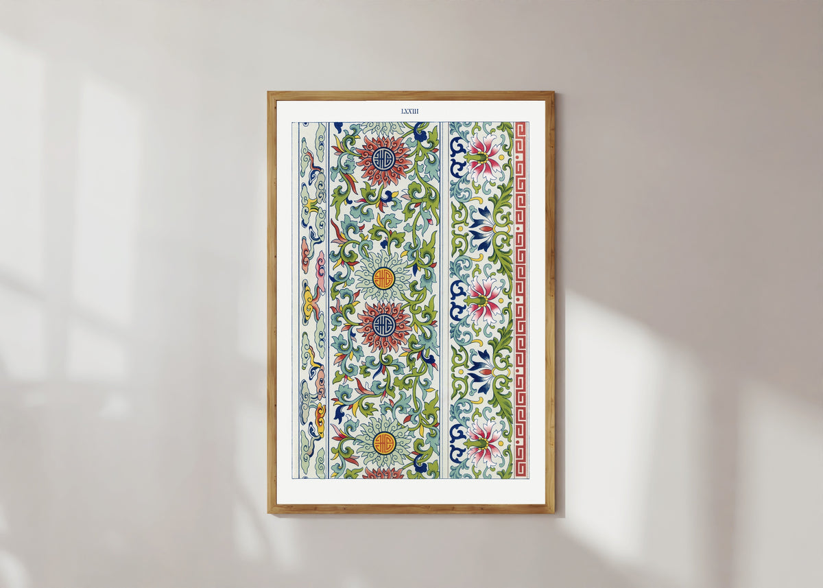 Framed art print of Examples of Chinese Ornament, Plate 73 by Owen Jones, in a light wood frame on a sunlit white wall