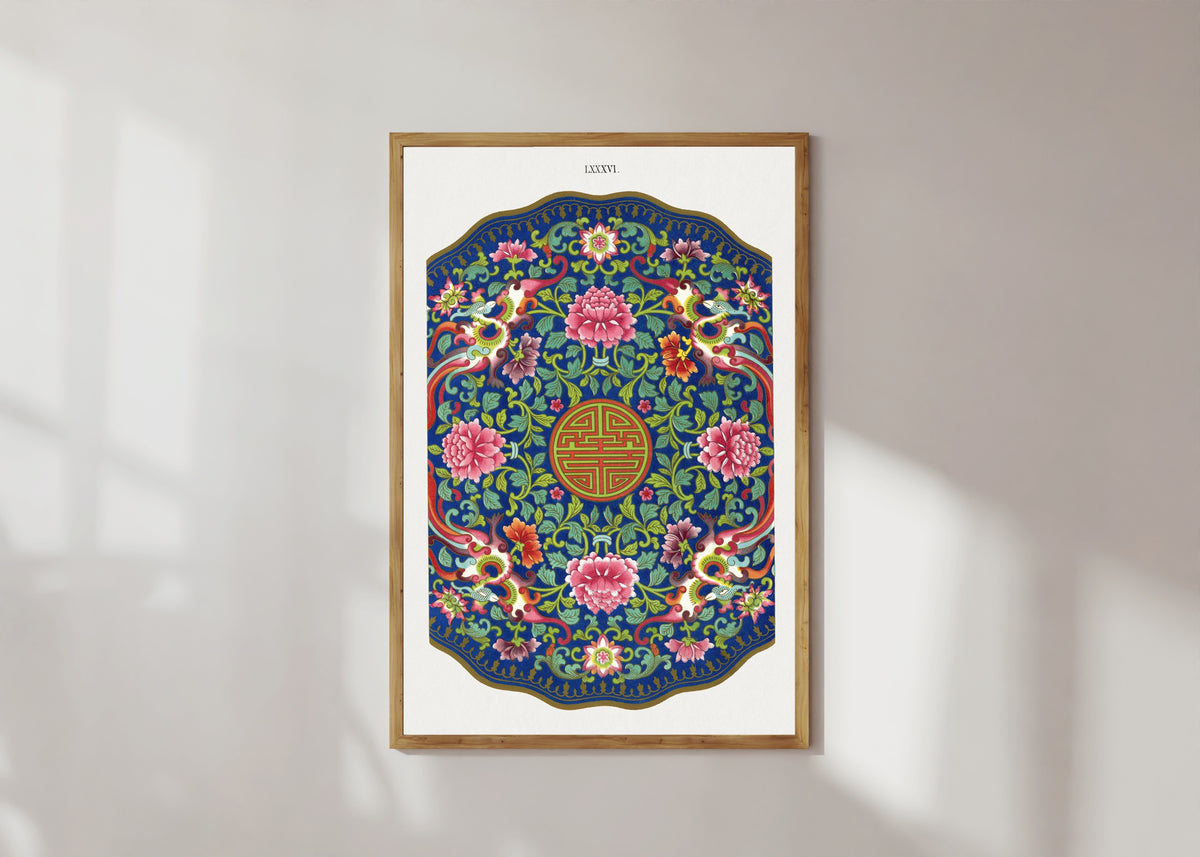 Framed art print of Examples of Chinese Ornament, Plate 86 by Owen Jones, in a light wood frame on a sunlit white wall