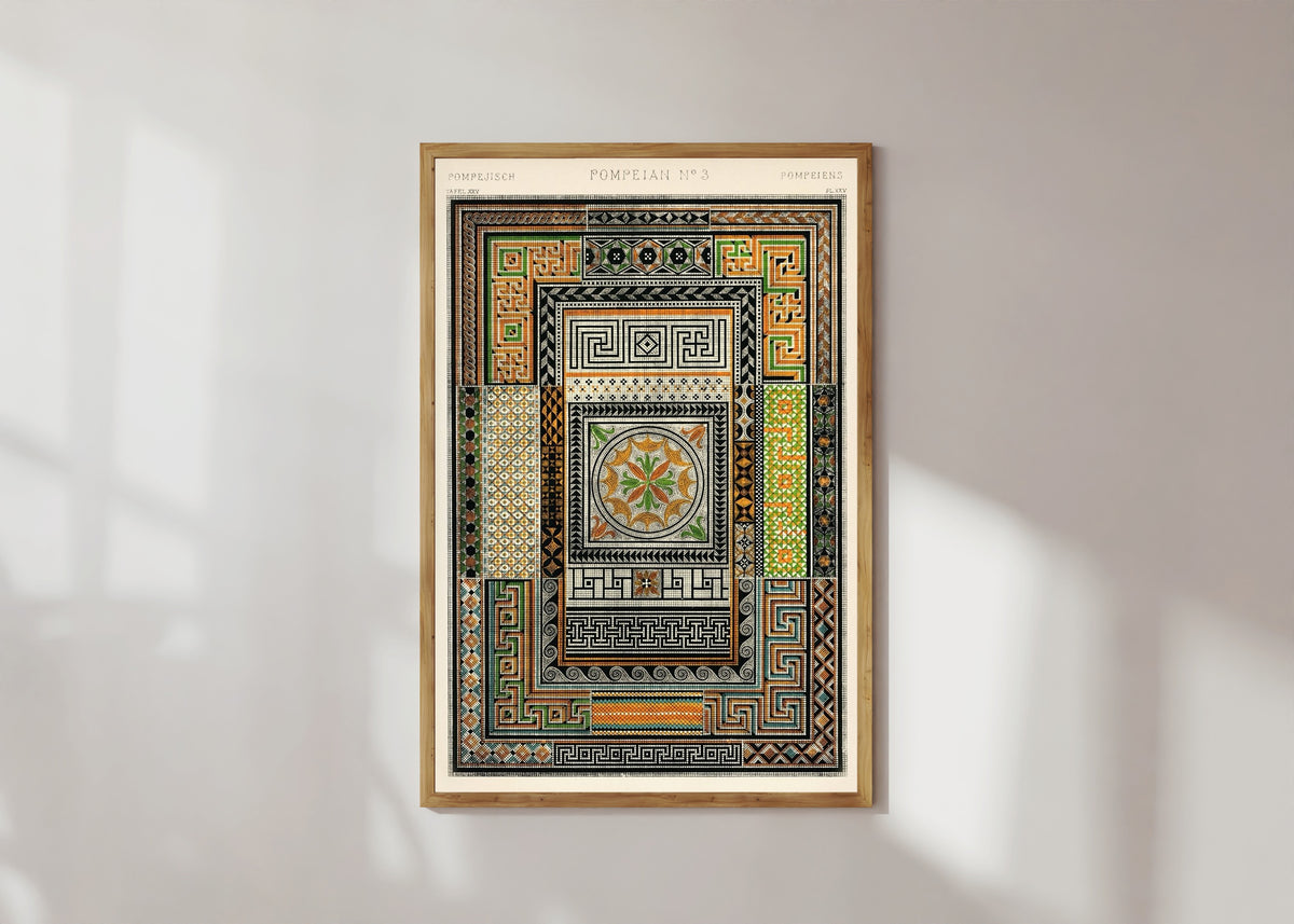 Framed art print of Pompeian by Owen Jones, in a light wood frame on a sunlit white wall
