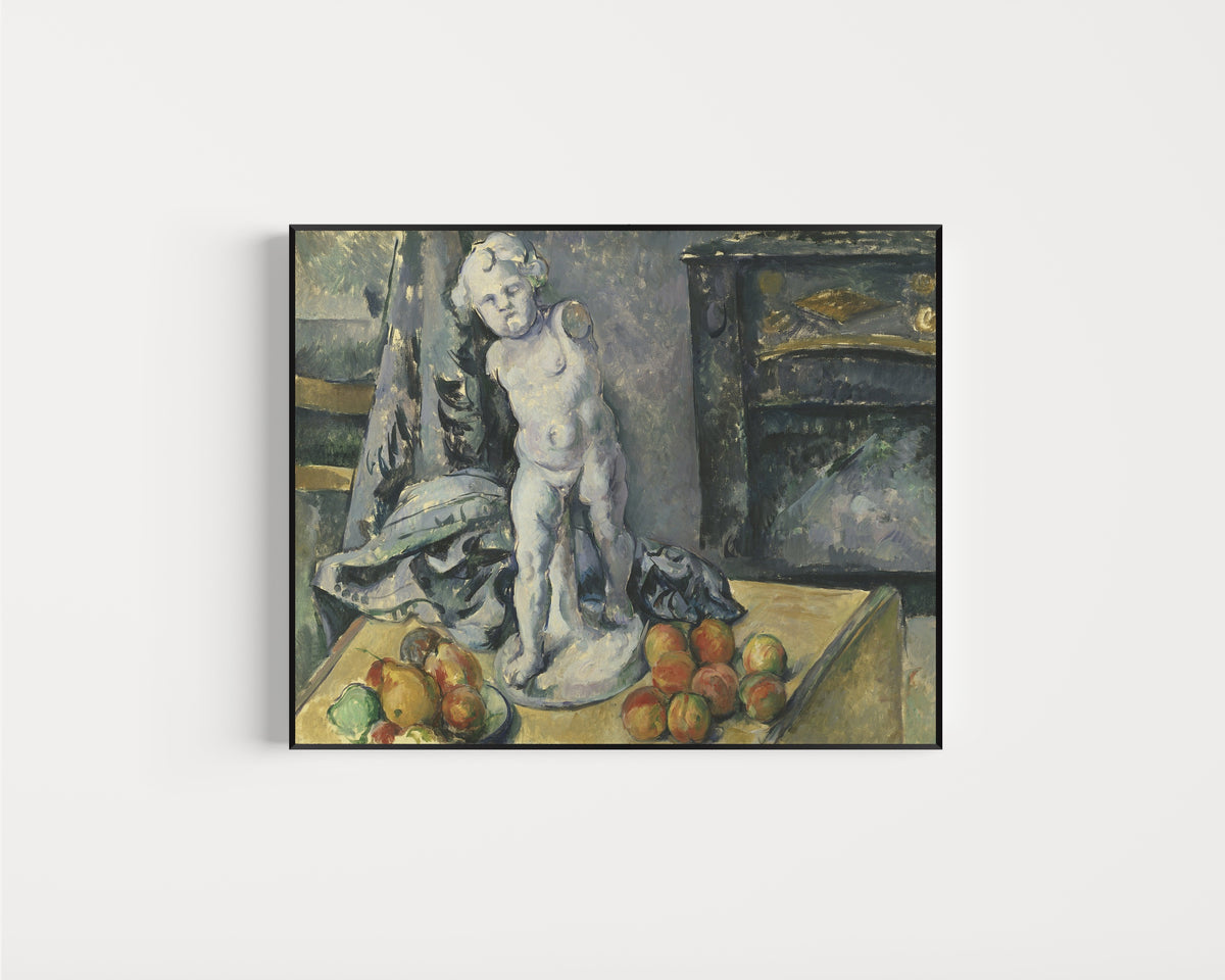 Framed art print of Still Life with Plaster Cupid by Paul Cezanne, in a slim black frame on a plain white wall