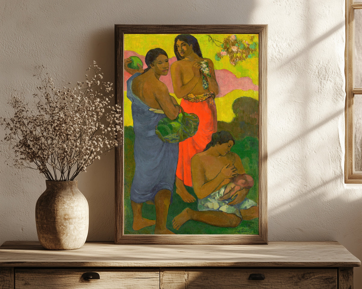 Framed art print of Maternité II by Paul Gauguin, in a dark wood frame leaning on a rustic console beside dried flowers