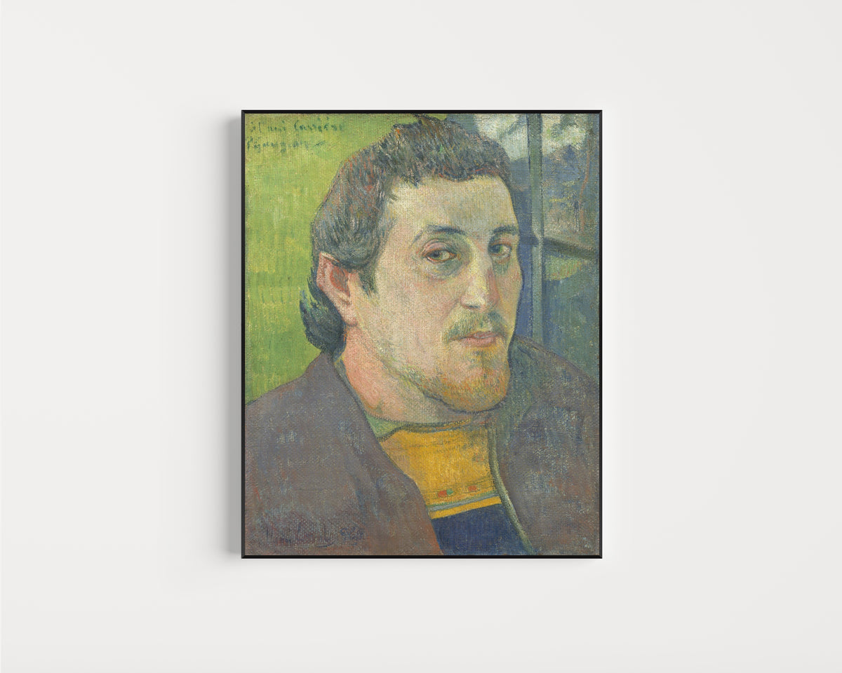 Framed art print of Self-Portrait Dedicated to Carrière by Paul Gauguin, in a slim black frame on a plain white wall