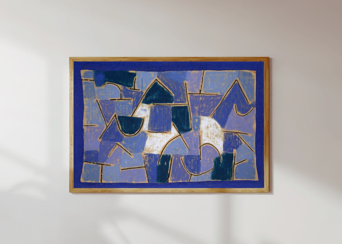 Framed art print of Blue Night by Paul Klee, in a light wood frame on a sunlit white wall