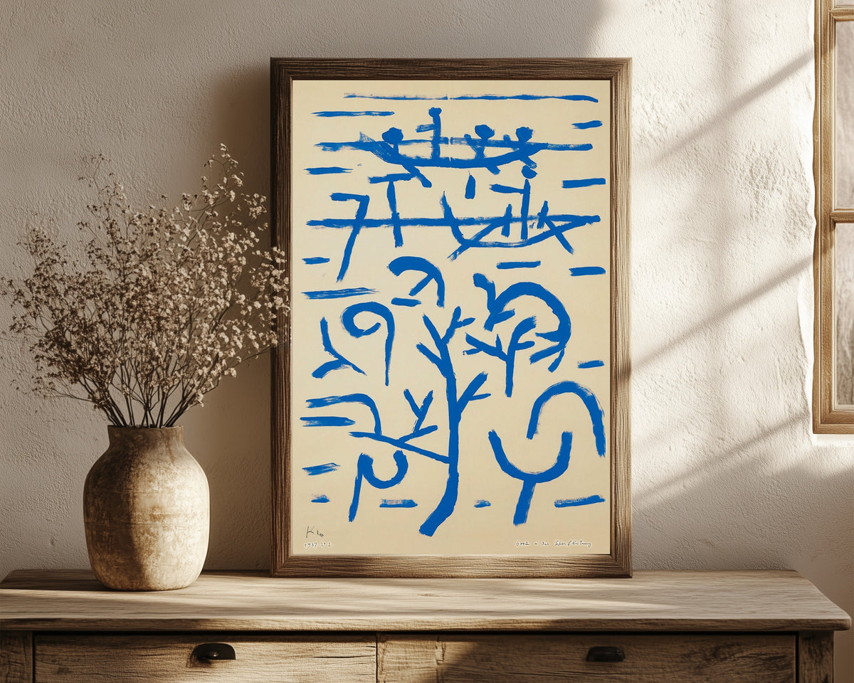 Framed art print of Boats in the Flood (Boote in der Überflutung) by Paul Klee, in a dark wood frame leaning on a rustic console beside dried flowers