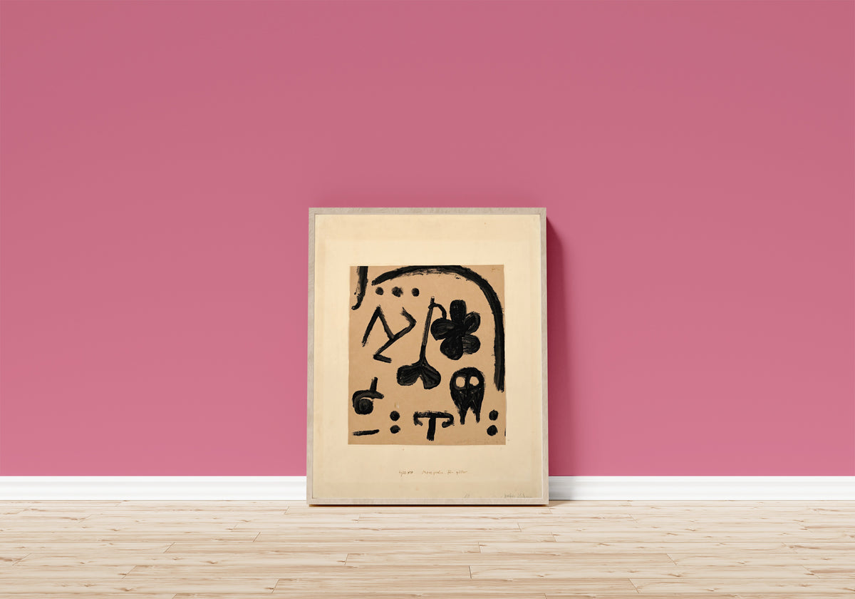 Framed art print of Marks for Later by Paul Klee, in a light wood frame leaning on a pink wall above a wooden floor