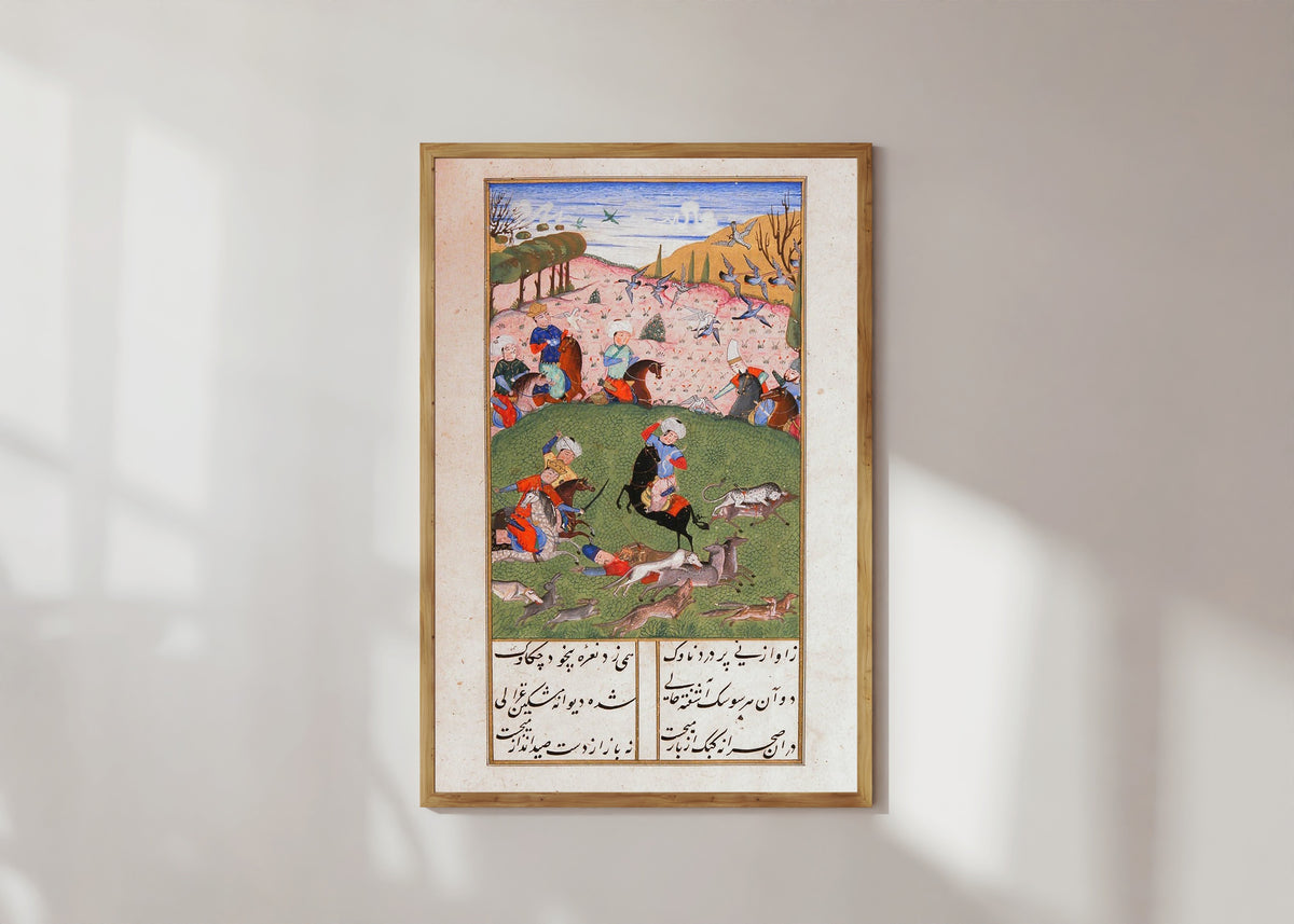 Framed art print of Khusrau and Shirin: Khusrau Hunting with His Companions by Suzi, in a light wood frame on a sunlit white wall