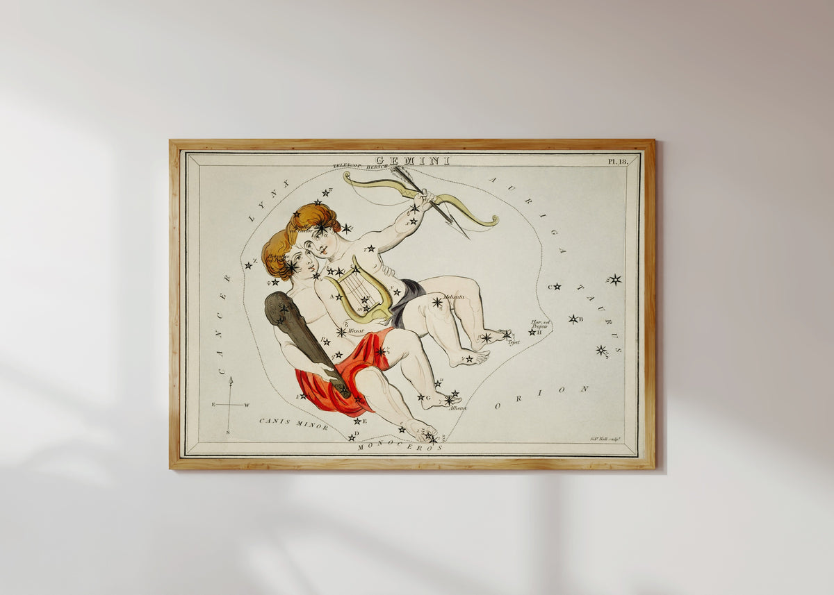 Framed art print of Gemini by Sidney Hall, in a light wood frame on a sunlit white wall